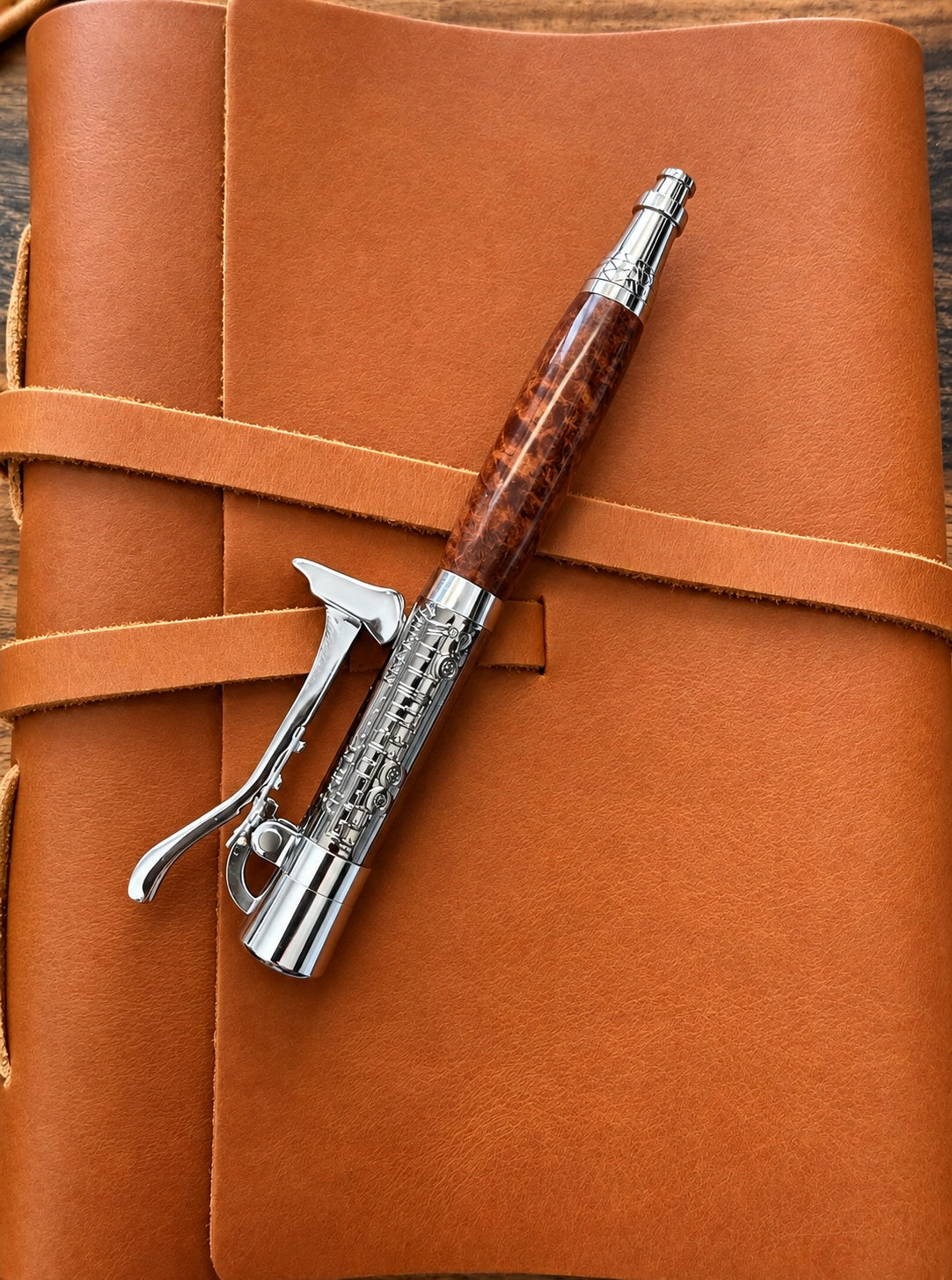 Pacey EMT/Firefighter ballpoint pen with amboyna burl barrel and axe-inspired lever-action click mechanism